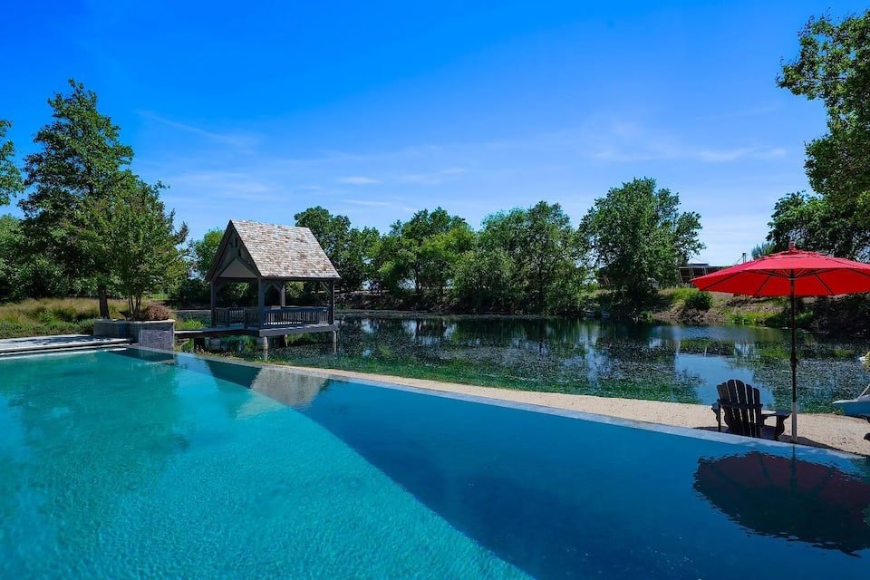 The infinity pool looking out over the lake and dock