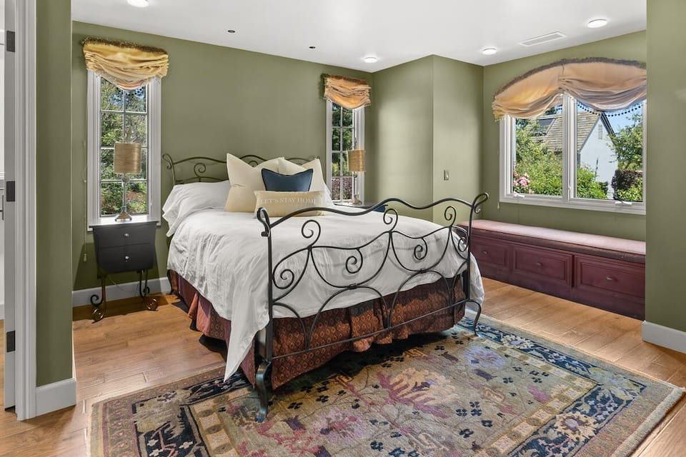The retreat bedroom with a queen bed and window seat